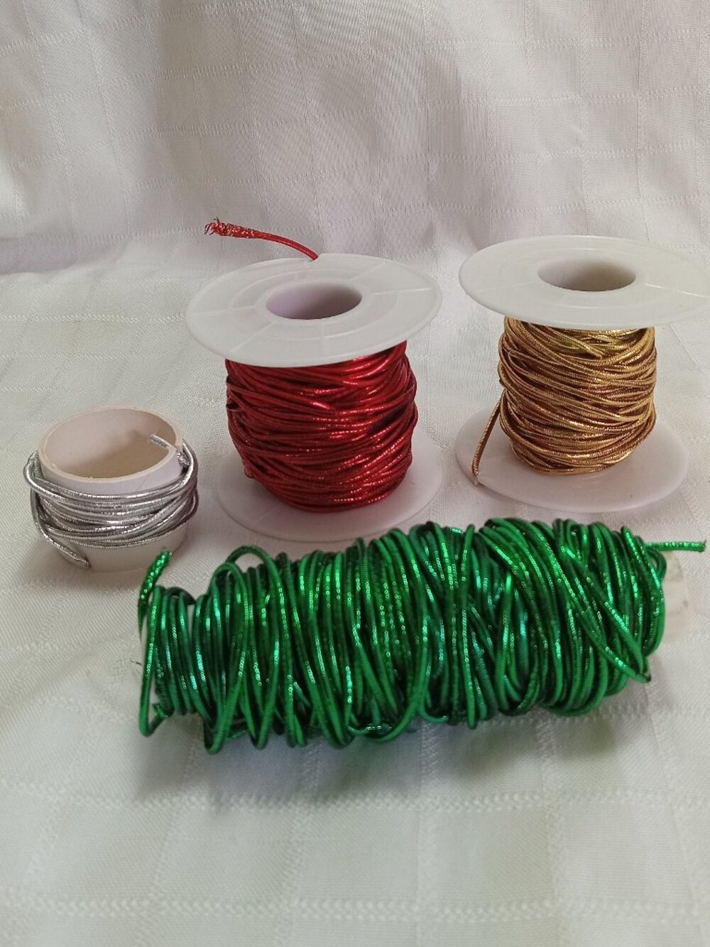 Very long lengths of shiny elastic cord left—perfect for holiday decorations